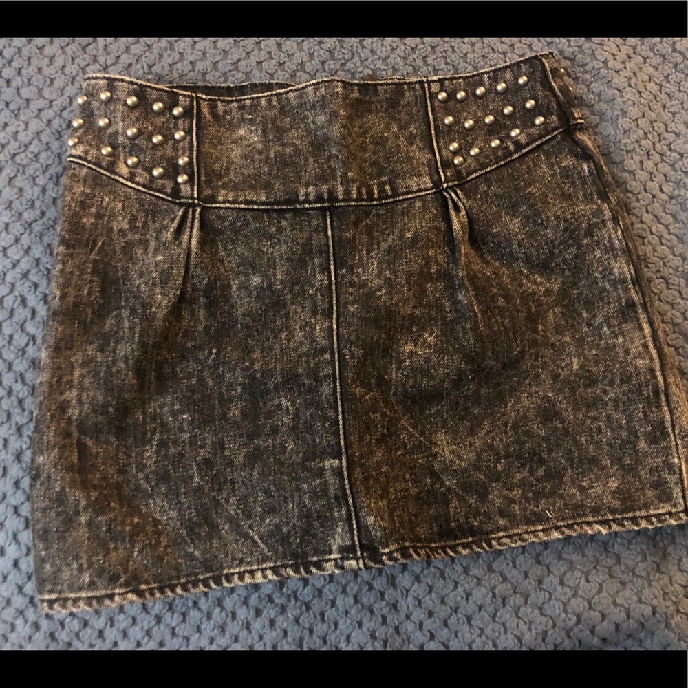 Distressed and studded black mini jean skirt